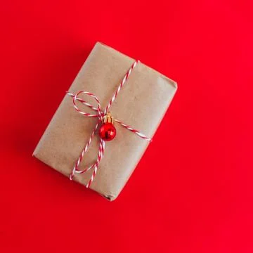 Christmas present on red background Stock Photos