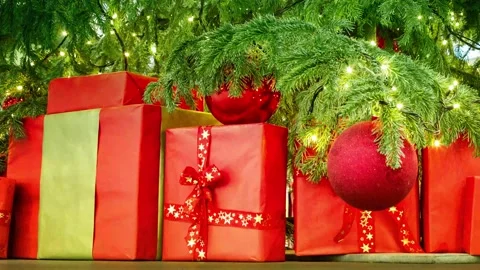 Christmas present in red wrapping under the christmas tree Stock Footage 144216560