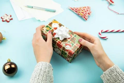Christmas present in woman's hands Stock Photos