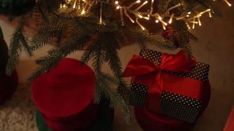 Christmas presents under a glowing tree. Stock Footage 321513383