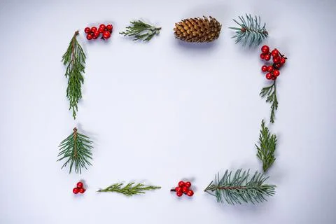 Christmas rectangular frame made of natural winter things on a gray backgroun 스톡 사진