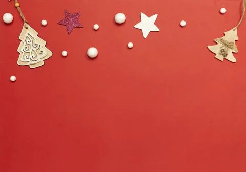 Christmas red background with copy space, stars and snowflakes. Stock Photos