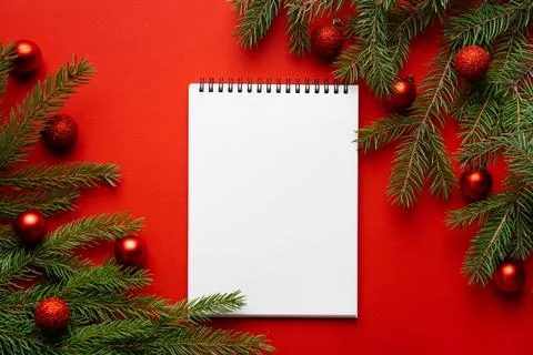 Christmas red background with spruce branch in the upper right corner, copy Stock Photos
