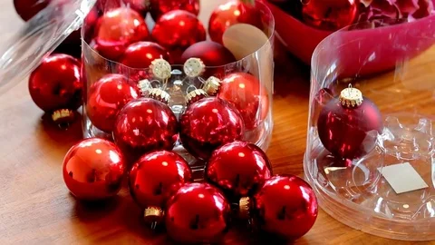 Christmas Red Balls in Transparent Plastic Boxes on Brown Wooden Table 動画素材 72425755