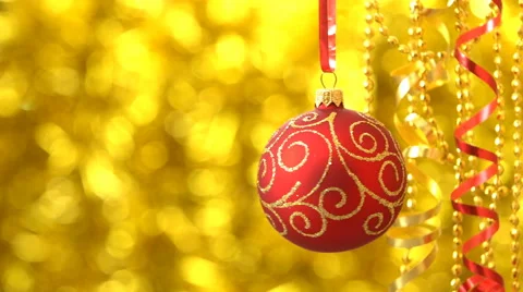 Christmas red with golden pattern ball swinging. New Year decoration. Blurred Stock Footage 68979978