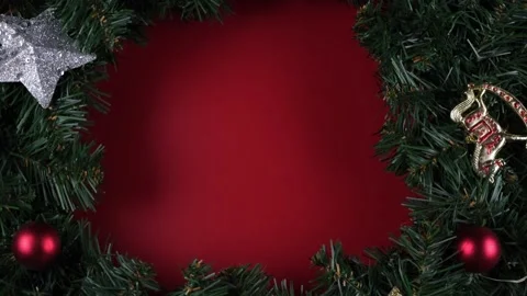 Christmas rotating wreath composition on a red background Stock Footage 166320734