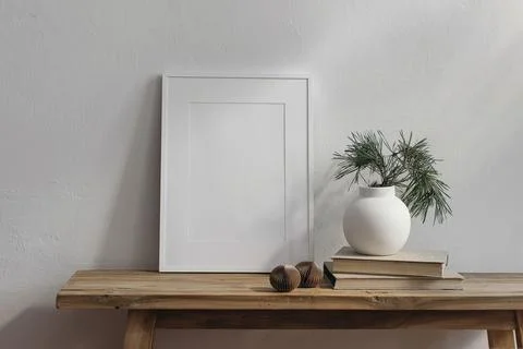 Christmas Scandi interior decor. Vertical white picture frame mockup. Vintage Stock Photos