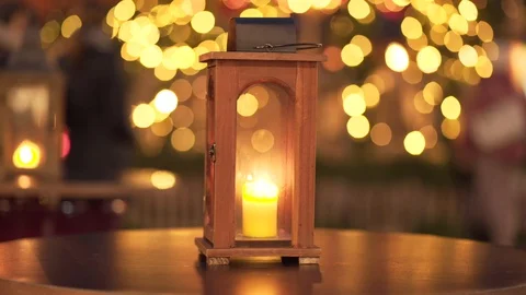 Christmas scene with burning candle. Lantern on table. New Year Stock Footage 129141237