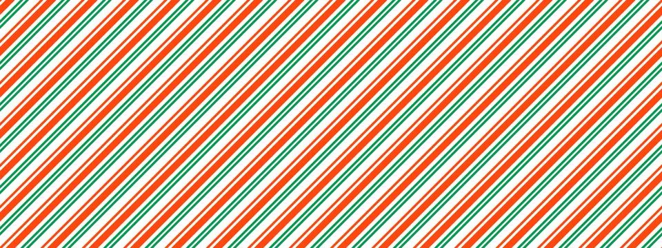Christmas seamless pattern. Red green diagonal dotted stripe background. Candy Stock Illustration