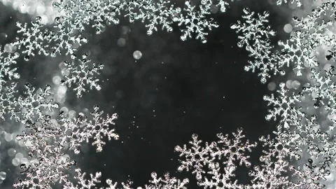 Christmas silver snow flakes border frame on black with flying glitter particles Stock Footage 150474814