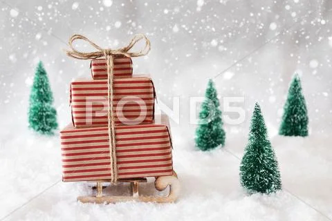 Christmas Sled On Snow With White Background And Snowflakes Stock Photos