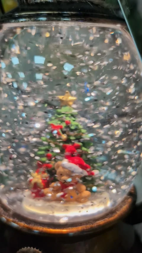 Christmas snow globe with festive tree and santa figurines Stock Footage 335886305