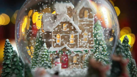Christmas Snow Globe with Snow Falling in Slow Motion and Lights Turning On Stock Footage 208932245