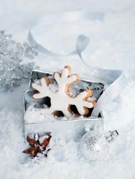 Christmas snowflake in a gift box Stock Photos