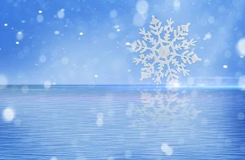 Christmas snowflake in water with reflection. Stock Photos
