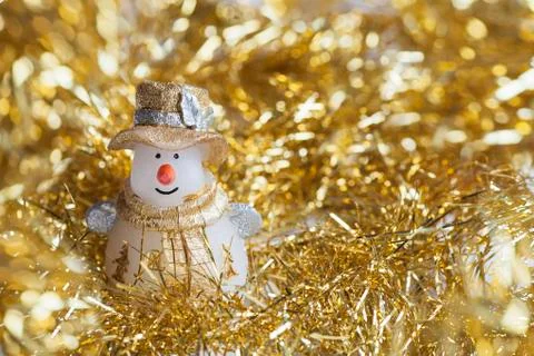 Christmas snowman decoration on gold sparkles backgraund Stock Photos