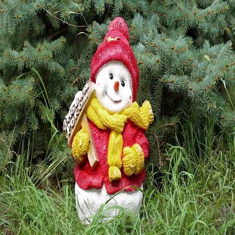 Christmas snowman on grass under the tree Stock Footage 69310289
