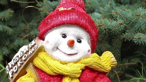 Christmas snowman on grass under the tree, Christmas in warm countries Stock Footage 72619124