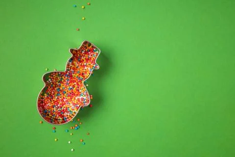 Christmas snowman shape form filled with colorful sugar sprinkles Stock Photos
