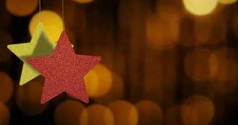 Christmas Star Ornaments are Swinging on Bokeh Background Loopable File Stock Footage 97717841