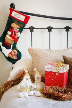 Christmas stocking on bed Stock Photos