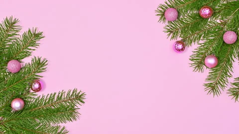 Christmas stop motion. Pine branches and pink ornaments with pearls appear Stock-Footage 163178672