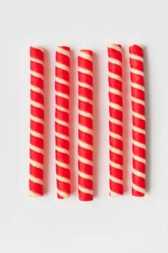 Christmas sweets. Close up of candy cane isolated Stock Photos