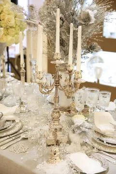 Christmas table, beautiful silver candlesticks with white candles and Cutlery Stock Photos