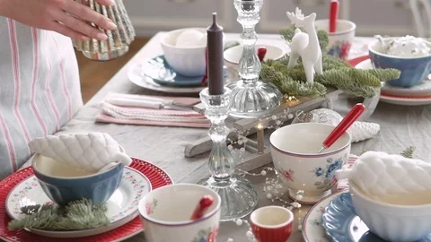 Christmas table decoration. festive table setting. Female hands decorate the Stock Footage 122684497