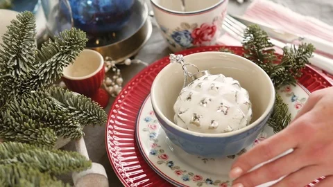 Christmas table decoration. festive table setting. Female hands decorate the Stock Footage 123341639