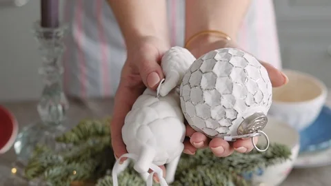 Christmas table decoration. festive table setting. Female hands decorate the Stock-Footage 123342359