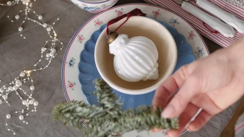 Christmas table decoration. festive table setting. Female hands decorate the Stock Footage 123342586