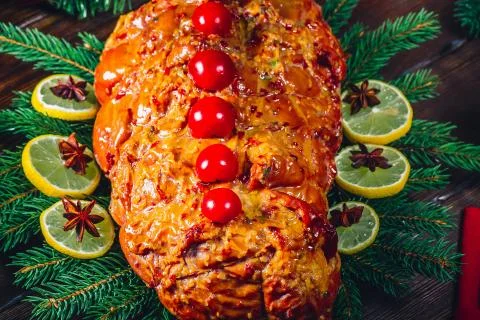 Christmas table dinner time with roasted meats, candles and New Year dcor. Ba Stock Photos