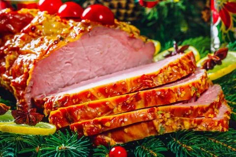 Christmas table dinner time with roasted meats, candles and New Year decor. B Foto stock