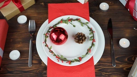 On the Christmas table empty plate and gifts Stock Footage 114648564
