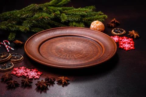 Christmas table with empty plate and surface with New Year's decorations Stock Photos