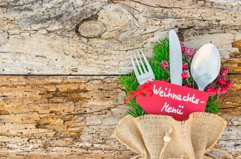 Christmas table place setting with  menu tag and german text, Weihnachts-Menu Stock Photos