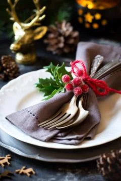 Christmas table place setting with silverware on a plate Stock Photos
