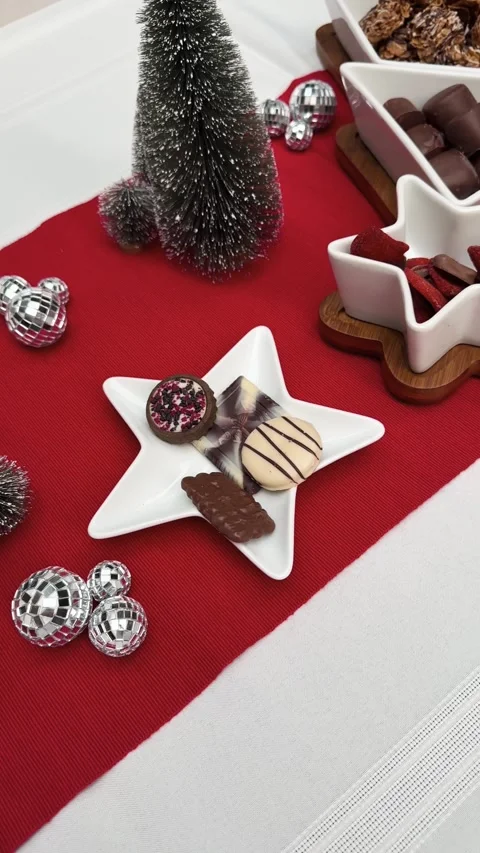 Christmas table runner with chocolates and colorful decor, hosting Stock Footage 327304867