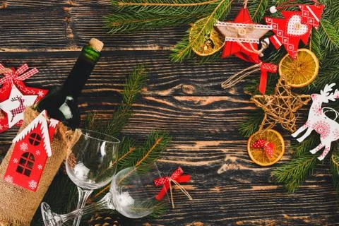 Christmas table serving, and a bottle of wine. New Year. Christmas tree and C Stock Photos