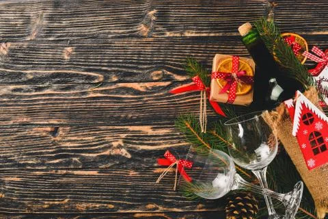 Christmas table serving, and a bottle of wine. New Year. Christmas tree and C Stock Photos