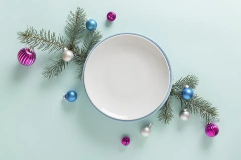 Christmas table setting and festive decor on a light blue background with fir Foto stock
