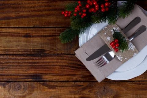 Christmas table setting on brown old wooden table Stock Photos