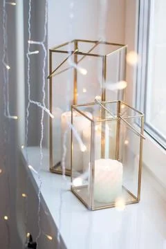Christmas table setting with burning candles, retro lights and champagne glas Stock Photos