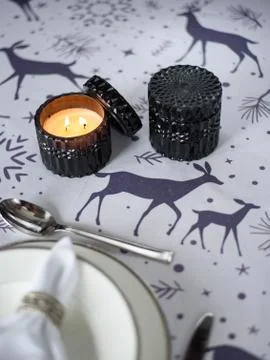 Christmas table setting with candles and decorations Stock Photos
