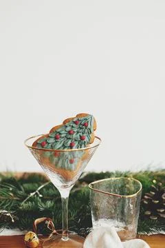 Christmas table setting. Christmas tree cookie in glass. Creative Holiday a.. Stock Photos