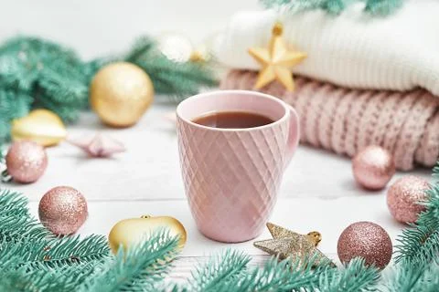 Christmas table setting. Cup of coffee or tea on background of Christmas tree Stock Photos
