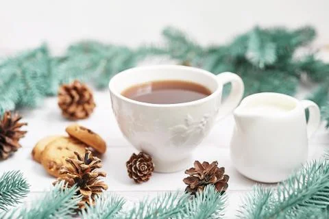 Christmas table setting. Cup of coffee or tea on background of Christmas tree Stock-Fotos