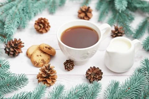 Christmas table setting. Cup of coffee or tea on background of Christmas tree Stock Photos