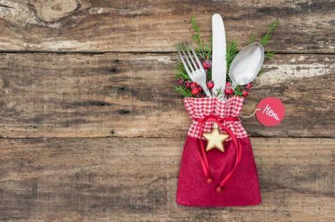 Christmas table setting with decoration with menu tag on wood background Stock Photos
